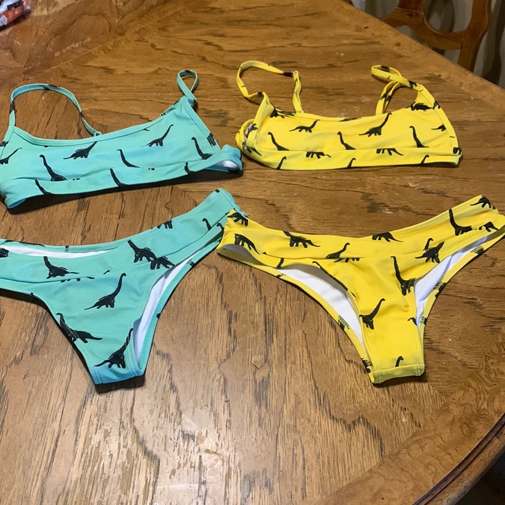 Two matching bikini one yellow one blue dinosaur size medium
